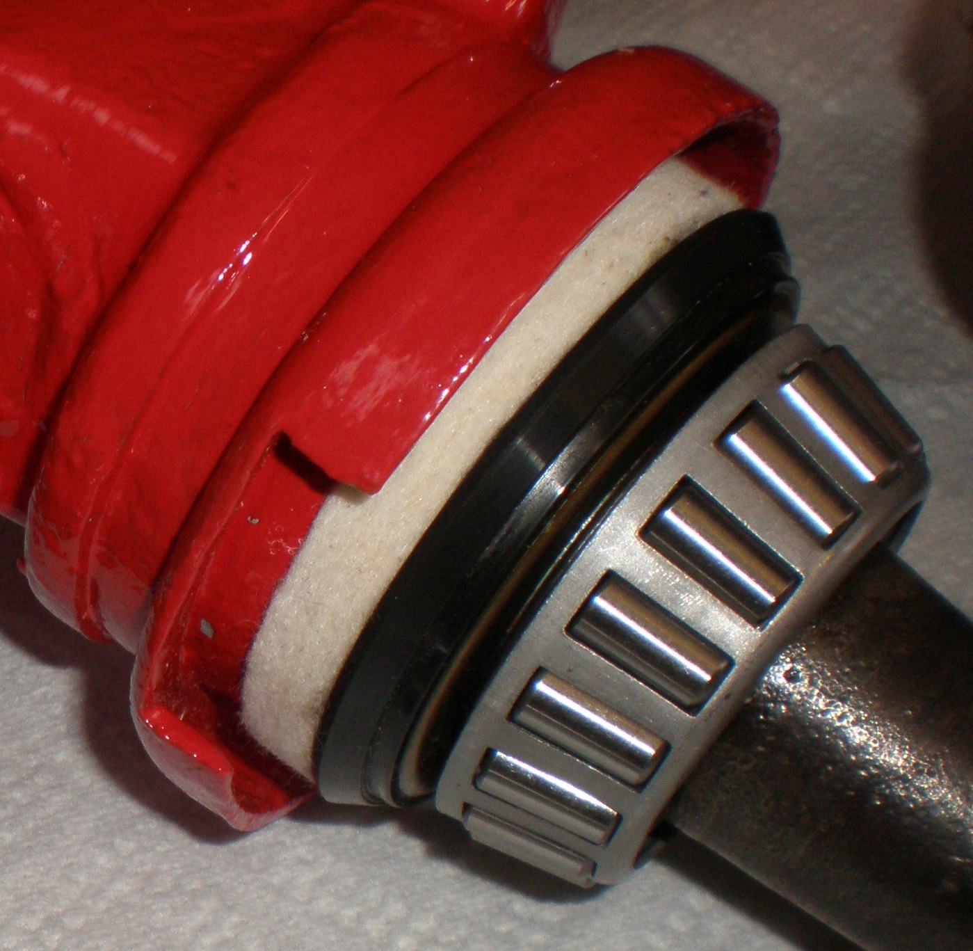 Tractor Steering Overhaul - Steering knuckle dust shield